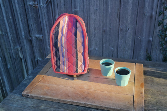 Modern pink striped cafetiere / French press cover / warmer. From Sterck & Co.