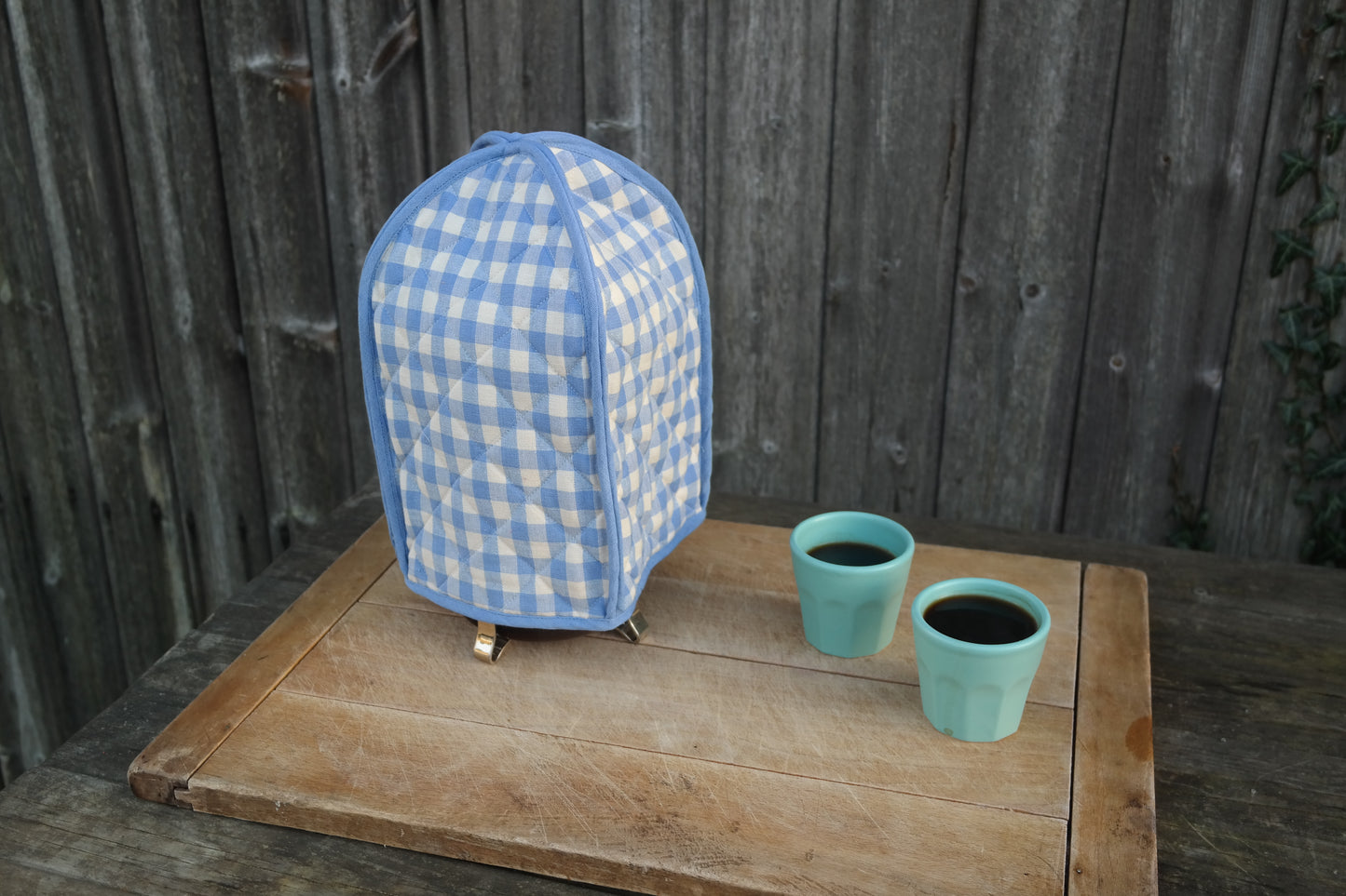 keep your pot of coffee warm with this classic blue gingham cafetiere / french press cover from sterck & co.