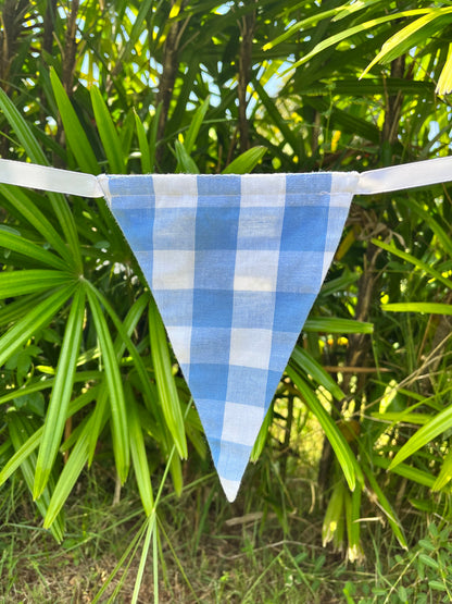 Close up of blue and white check flag on Balloo bunting from Sterck.