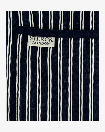 Classic blue and white striped cotton 'Butcher's Apron' with double front pockets and adjustable neck strap. Sterck & Co. Close up of fabric and pocket detailing.