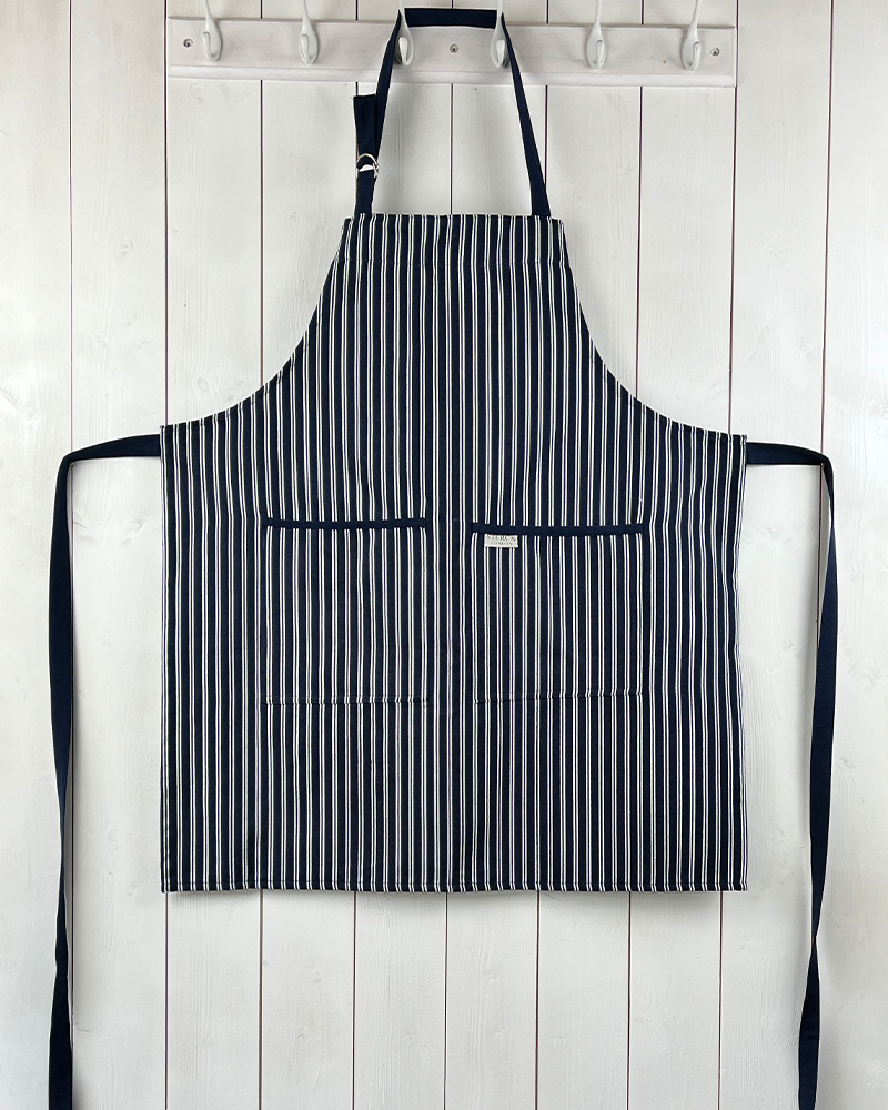 classic blue and white striped cotton 'butcher's apron' with double front pockets and adjustable neck strap. sterck & co.
