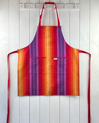 Chihuahua rainbow striped cotton apron with double front pockets, red ties and adjustable neck strap. Sterck & Co.