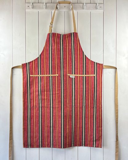 Chimichanga dusky red striped cotton apron with double front pockets and adjustable neck strap. Sterck & Co.