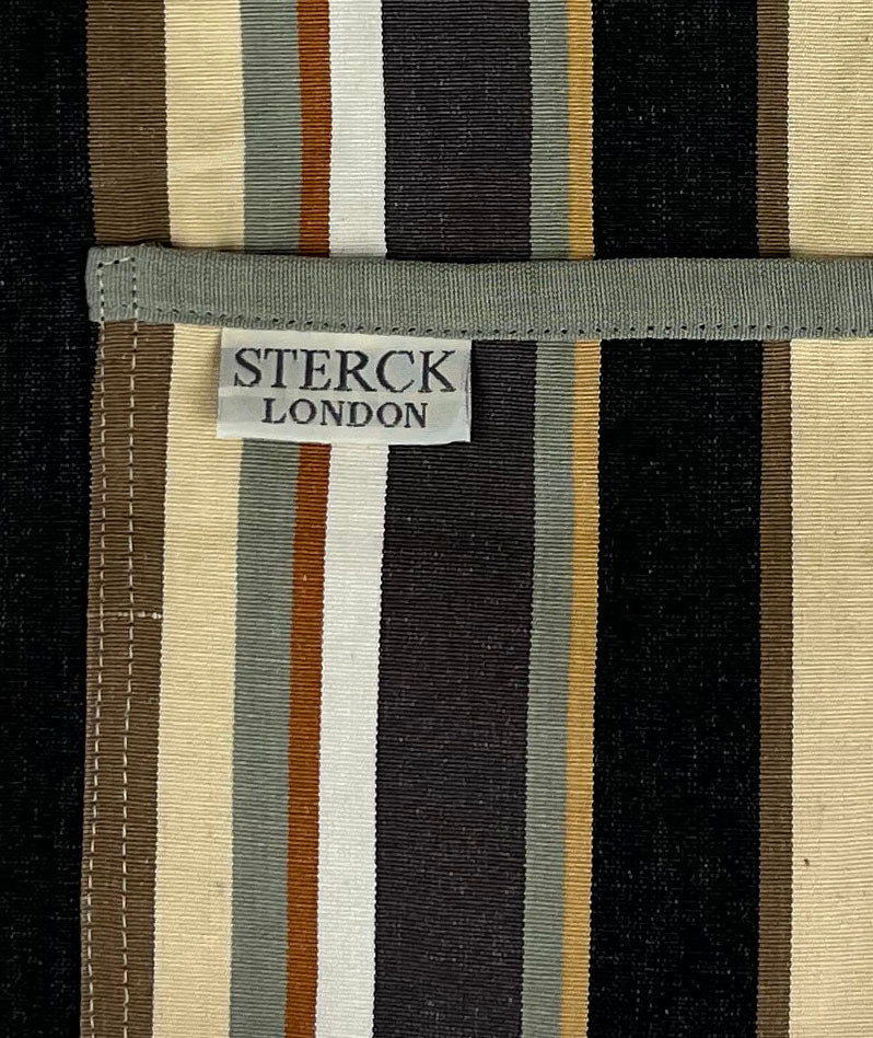  modern stylish stripy cotton apron, with double front pockets and adjustable neck straps. From Sterck & Co. Close up of fabric and pocket detailing.