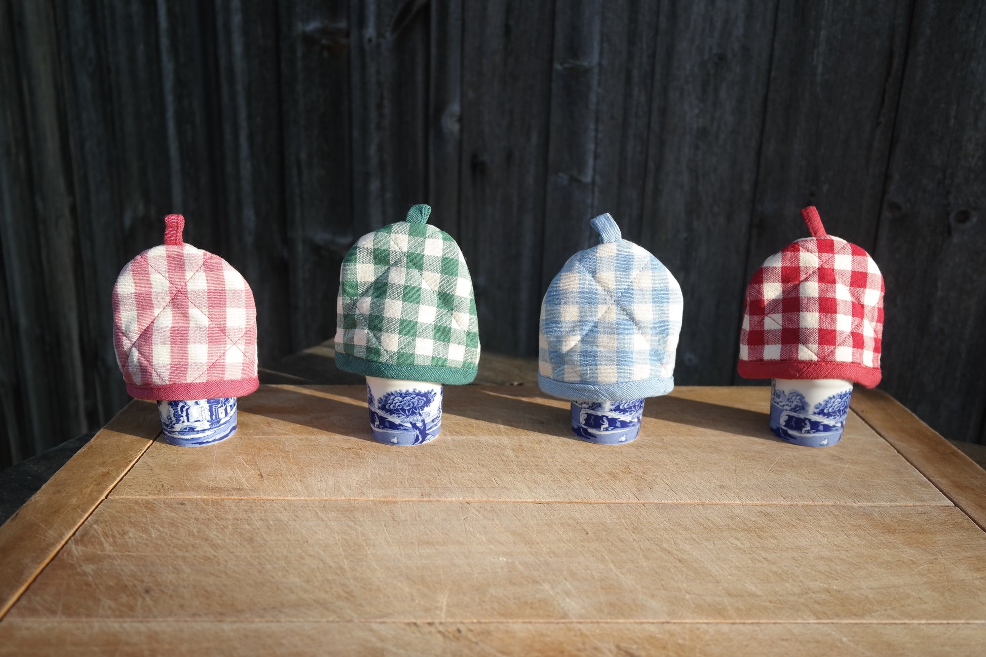 Gingham egg cosies in pink, green, blue and red