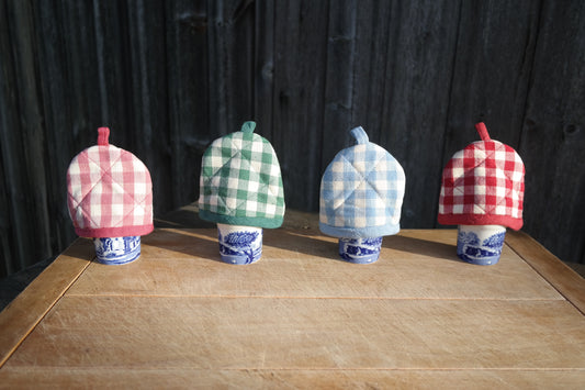 Gingham egg cosies in pink, green, blue and red