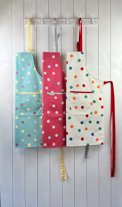 Collection of three cotton spotty aprons from Sterck & Co.