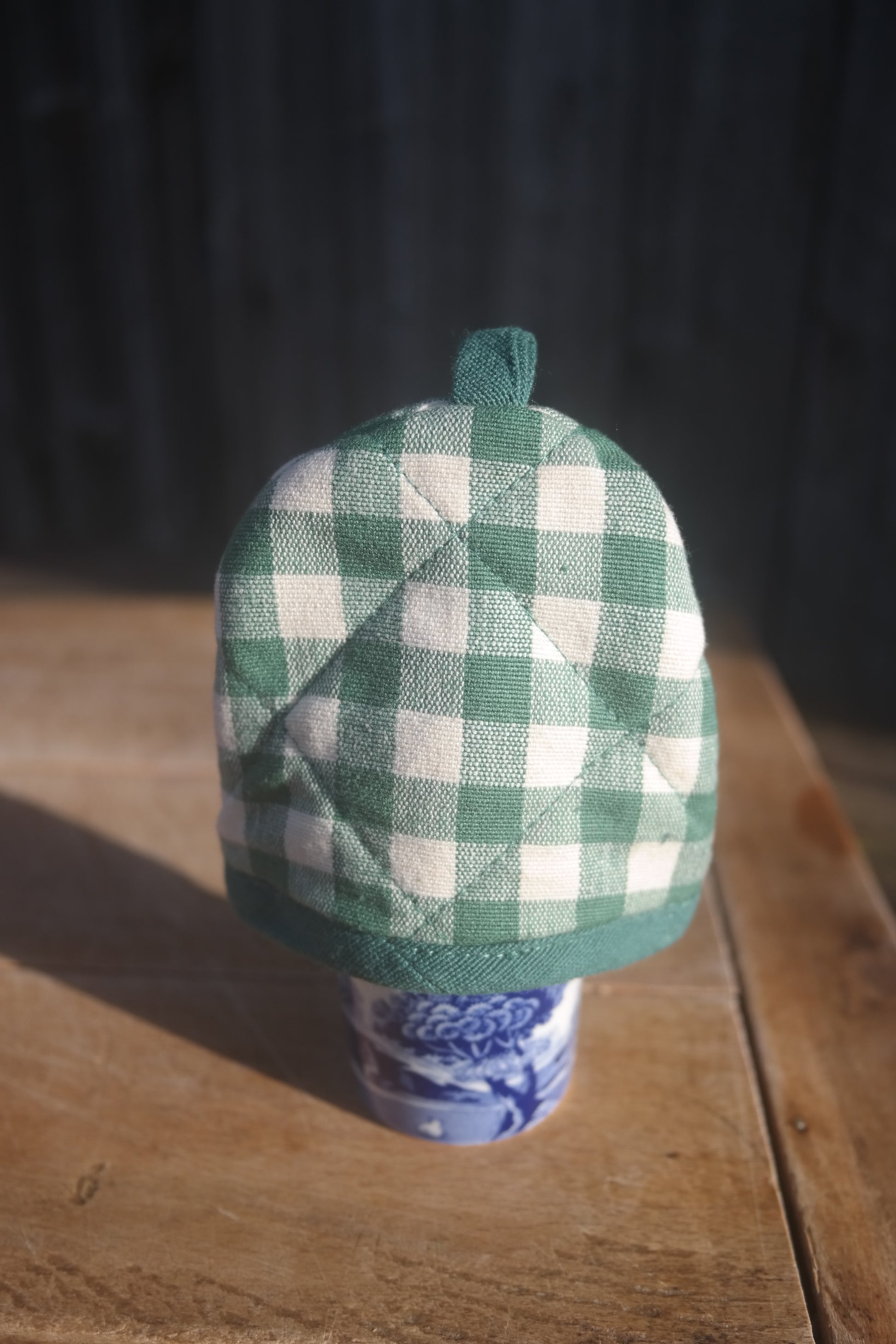 green gingham egg cosie